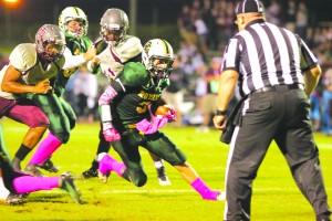 Senior Jordan Nase runs the ball. Nase is a proud supporter of Breast Cancer Awareness Month. Photo by Debra Thomas. 