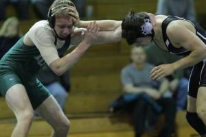 Senior Matt Burgess wrestles against Matoaca. Matoaca, like Prince George, was in the Central District  before the regrouping and is now in Conference 12. Photo by  Corey Lee.