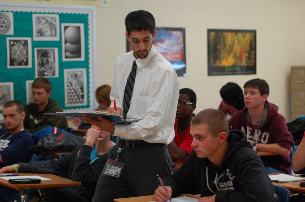 





































Andrew Castellano checks his Algebra I students work. 

