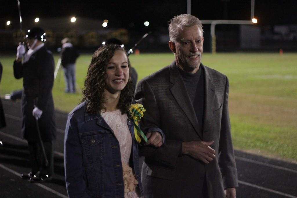 JoJo Taylor is escorted her father. Photo by Daniel Puryear. 