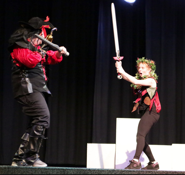 Captain Hook (played by senior JT Stawarz) and Peter Pan (played by senior Danielle Marshall) duel. Photo by Ian Kelty.  