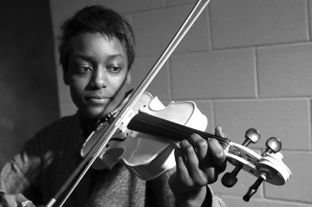 Junior Idalis Webb rehearses her music as the lone violin player. Webb began to learn to play by watching YouTube videos. Photo by Danielle Marshall.
