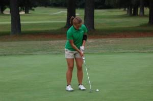 Sophomore Haley Bendall  gets set to put. Bendall was the only girl on the golf team this past season. Photo by  Corey Lee.