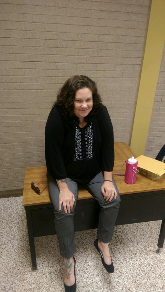 U.S. history and personal finance teacher Catherine Beasley waits for students to arrive at the tardy station during her lunch duty.