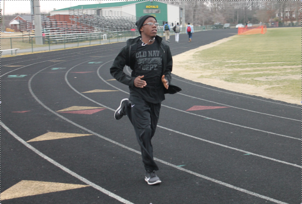 Junior Brandon Evans practices his 800 meter outside of organized practice. Photo by Tiana Whaley.