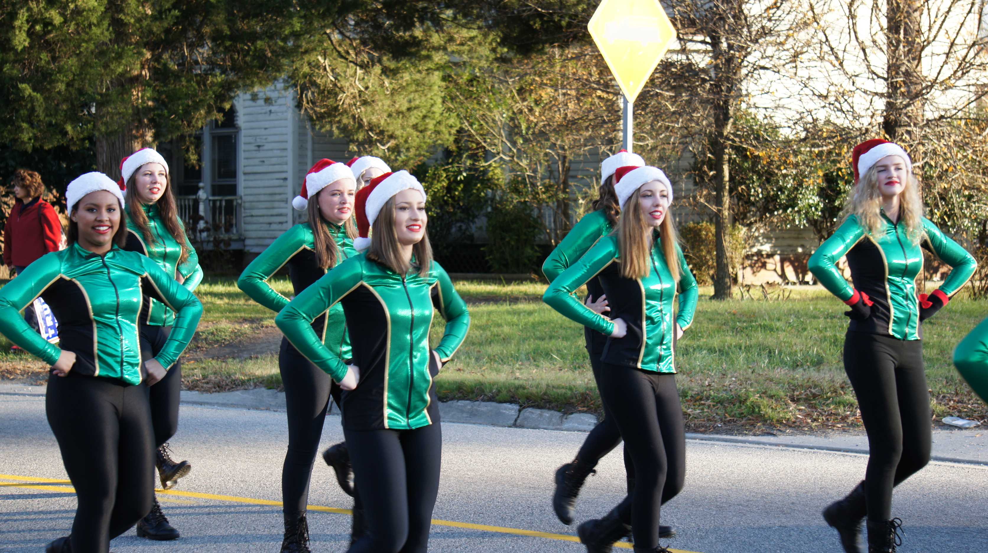 Royalettes, including Rebecca Johnson, dance at the parade.