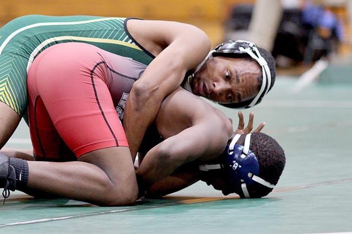 Senior+Jayon+Cosby+prepares+to+turn+his+opponent+to+score+the+point.+Wrestling+faced+Colonial+Heights+in+a+tri-meet+which+also+included+Matoaca.+Photo+by+Neelyan+Pagan-Rodriguez.+