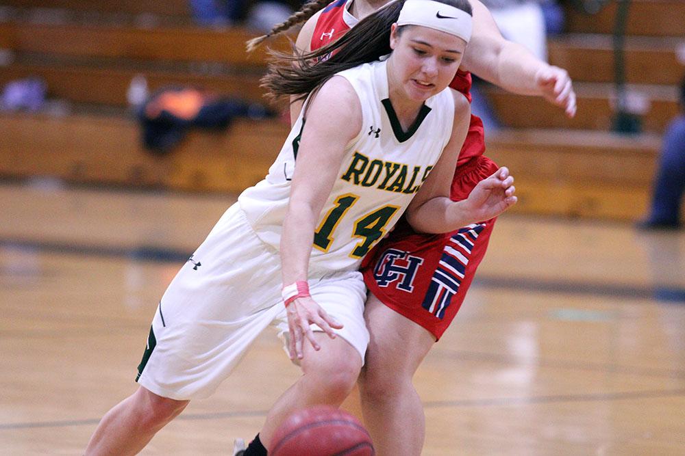 Sophomore guard Rachael Blumenschine drives the lane against the Colonial Heights defender. Blumenschine scored 14 points on the night. Photo by Madison Bailey.