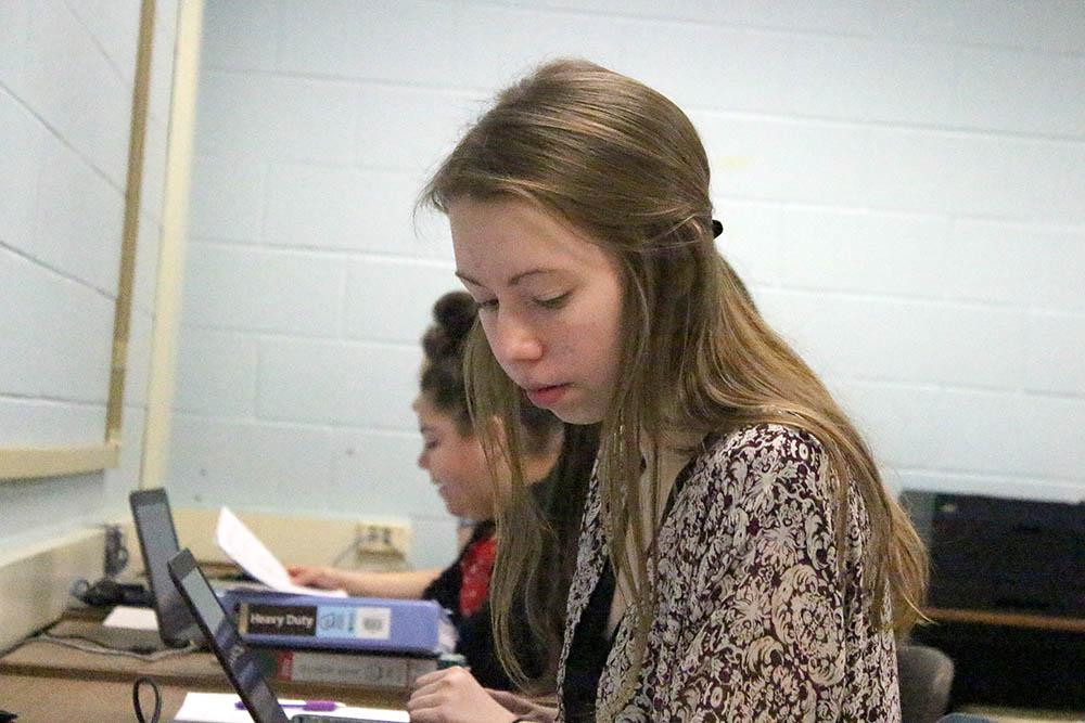 Sophomore Grace Roane types on a computer, hard at work on her IB project. For her project, Roane collected supplies for the Hopewell Humane Society.  Photo by Anna Mitchell.