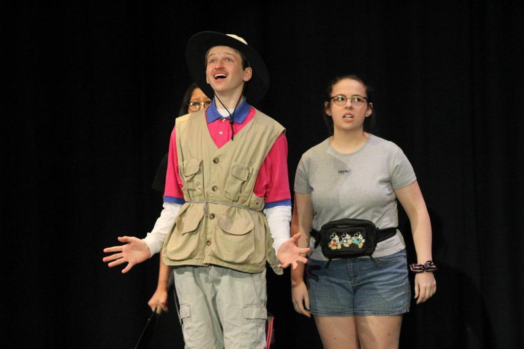 Senior Nick Humphries (left) and sophomore Abbie Glazier (right) walk onstage. The pair performed in the PG Players production of the play Our Place.