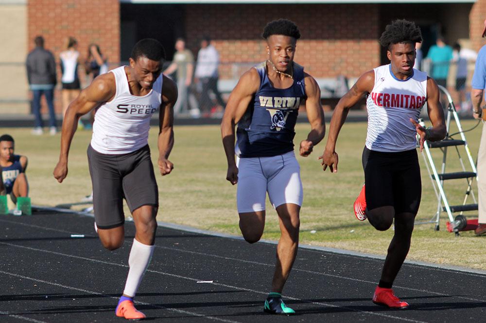 Junior Javonte Harding (left) sprints to a regional title in the 55m dash. Photo by Chandler Coleman.
