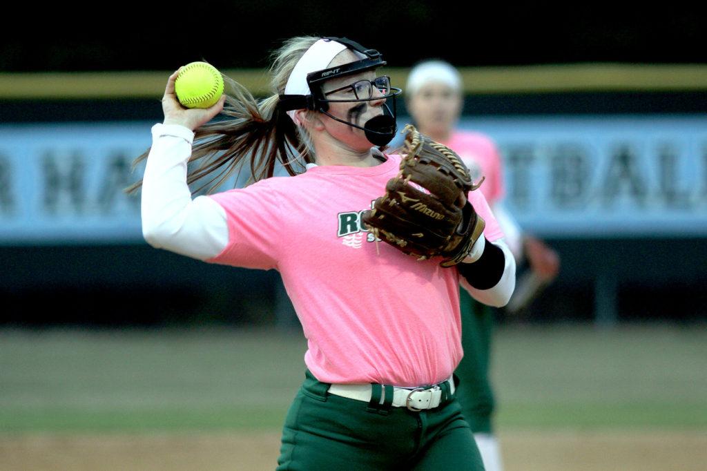 Junior pitcher Erin Miles tosses the ball to first after fielding her position on the mound. Photo by Jenna Miles.