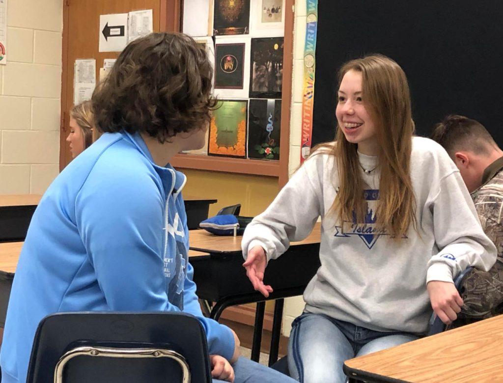 Sophomore Grace Roane discusses the final steps of her project with a fellow IB classmate. Roane worked with the Prince George Animal Shelter to raise understanding of the countys stray pet population. Photo by Lisa Parker.