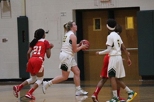 Senior Molly Ashcraft drives the lane for the layup to help stretch the lead against Dinwiddie.