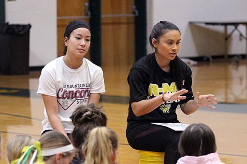Prince George alumni Laura Thompson and Casey Abernethy address the campers about the lessons theyve learned in the sport of softball. Photo by Maddison Shawkey.