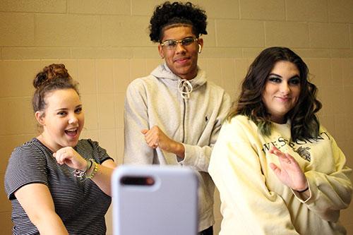 Seniors Brooke Lawerence and Alison Worley make a TikTok with junior Patrick Lockett. Lawerence, Worley, and Lockett make TikToks in their spare time.
 Photo by Shelby Hayes.