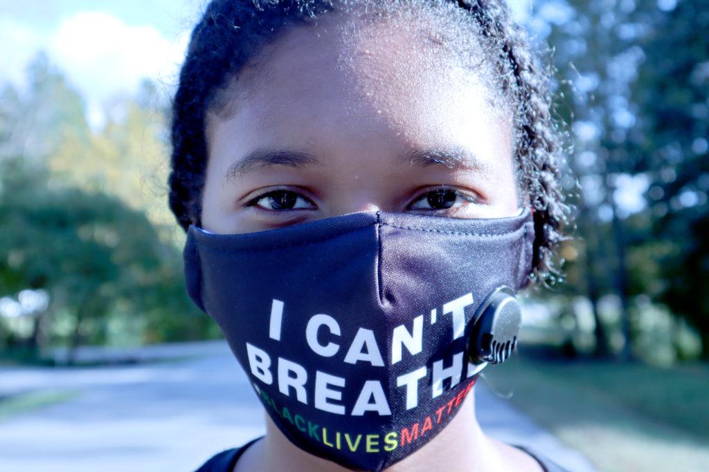 Cameron Johnson with a George Floyd inspired, Black Lives Matter face mask, remains stoic as she continues to be concerned about the state of civil rights.
Photo by Kaylaa White.
