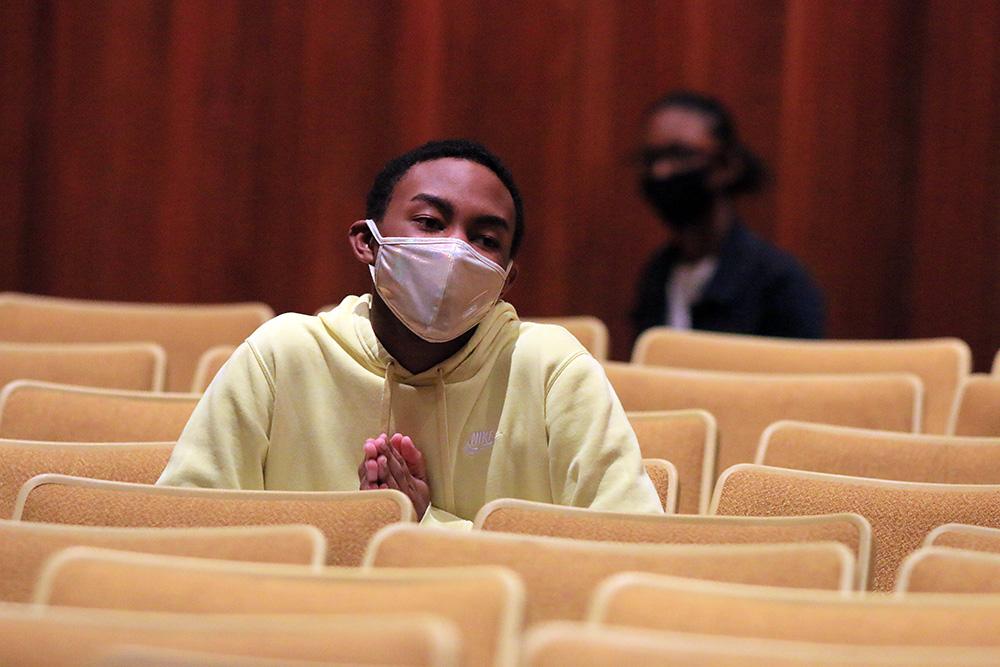 Senior Jamison Jones wears a mask while waiting to perform at a choir rehearsal. Although the masks made singing more difficult, the students practiced with them to remain safe from  spreading COVID-19. Photo by Brooke Damron.
