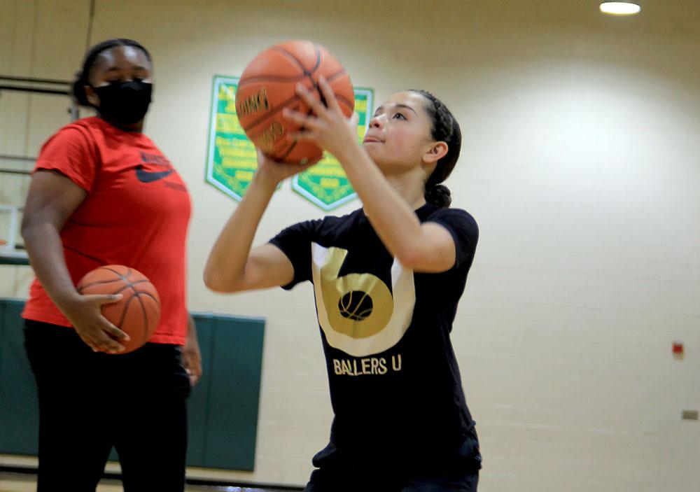 Eighth grader Tiana Sanchez runs through shooting drills at JEJ Moore Middle School. Sanchez is part of a group of girls who meet on Tuesdays and Thursdays to prepare for 
the upcoming season. 
Photo by Royals Media.