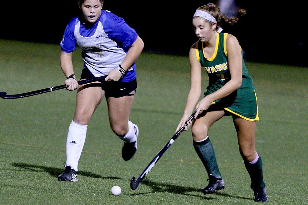 Sophomore Ella Warren  attacks the goal from the left side. Warren played with here travel squad Invasion at the River City Sportsplex, where many of the field hockey girls have competed while waiting for the VHSL season to start. Photo taken by Royals Media. 
