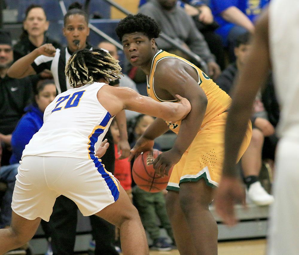 Senior Chris Allen sizes up the defense in a game against Hopewell in 2020. Allen is one of the returners preparing to play as the season starts on December 7th. 
Photo by Masako Kaneko.