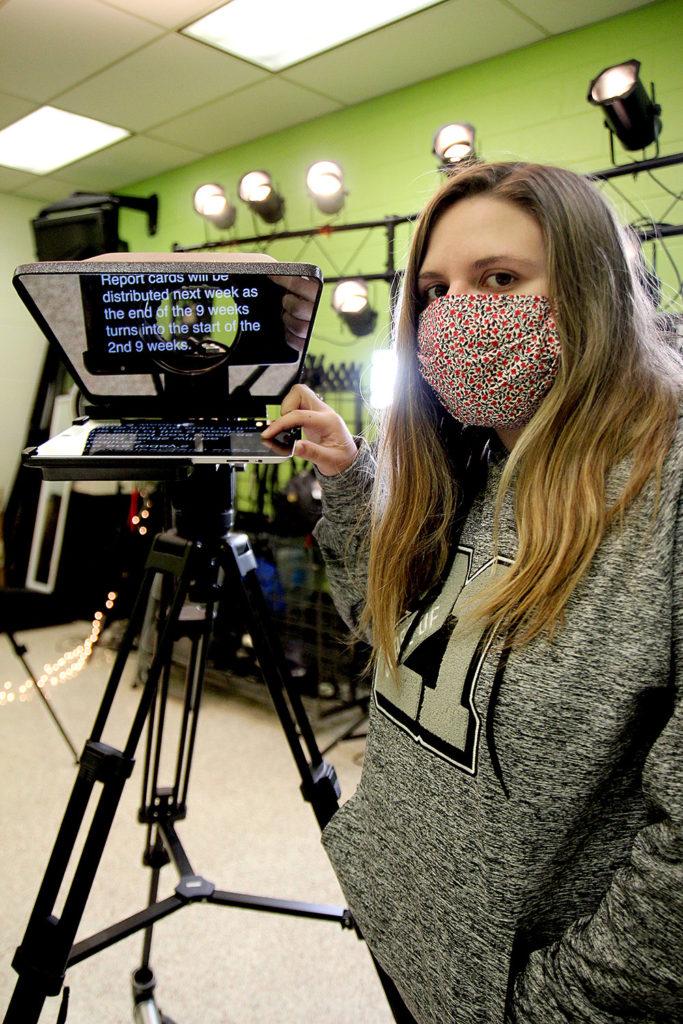 Senior Sydney Conner operates the teleprompter which is an iPad. Photo by Royals Media.